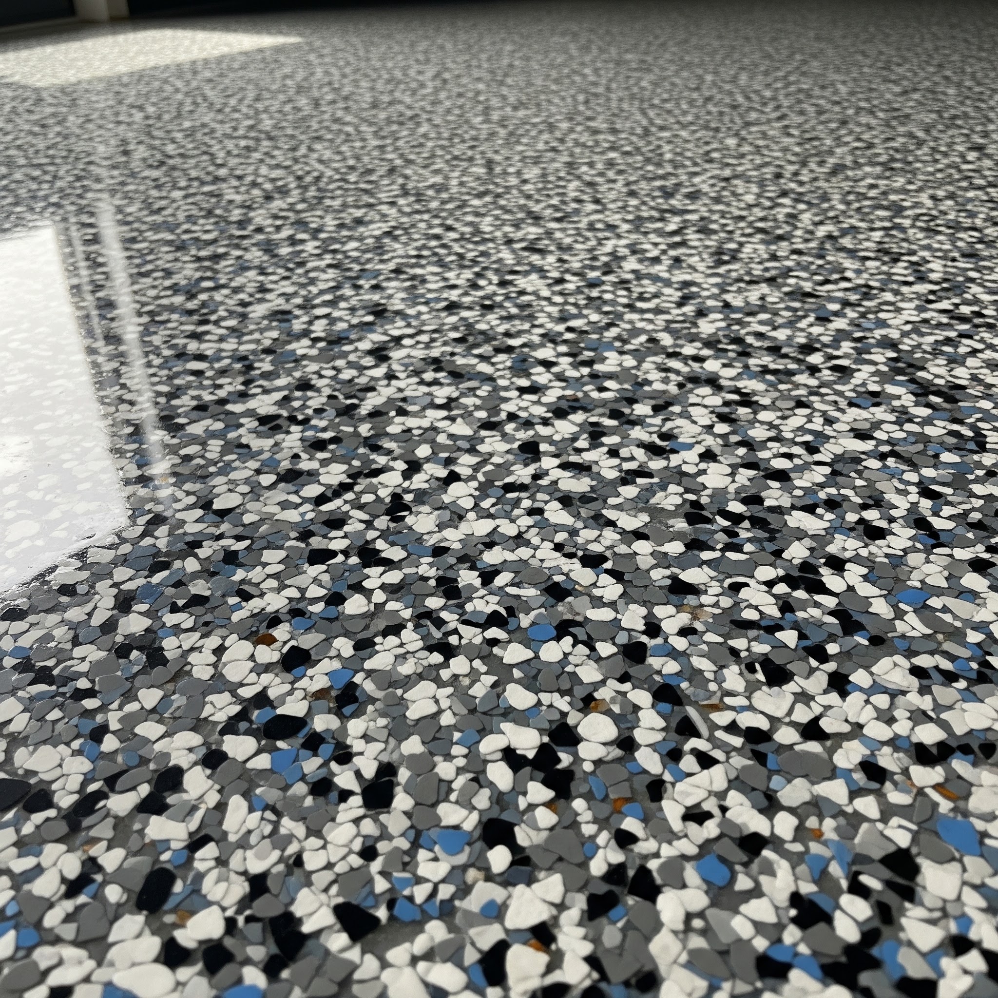 After: professionally coated epoxy garage floor