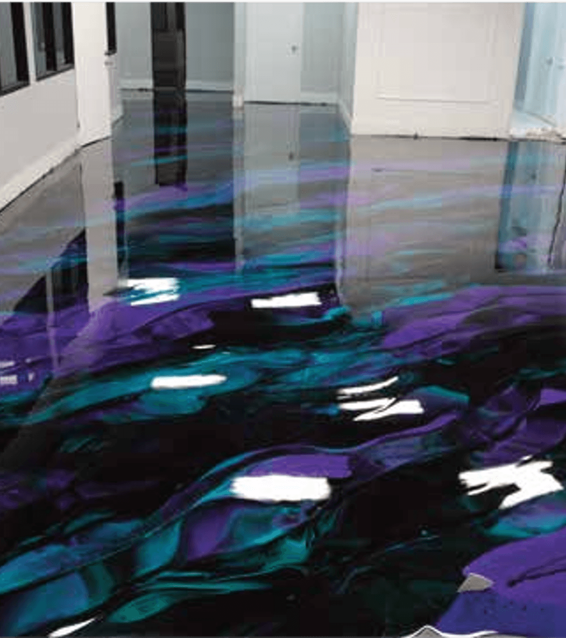 metallic epoxy floor with purple and teal swirls in a Dallas garage