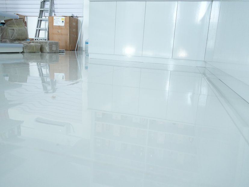 applying polyaspartic topcoat to epoxy floor